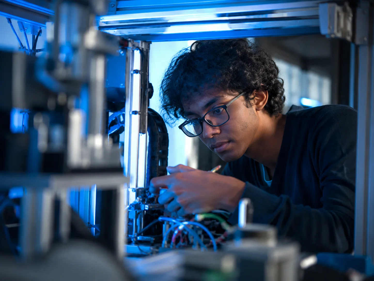 Two students running an experiment together in a university science lab